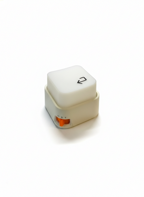 Front view of the Keylight Mini focus desk gadget on a grey concrete desk