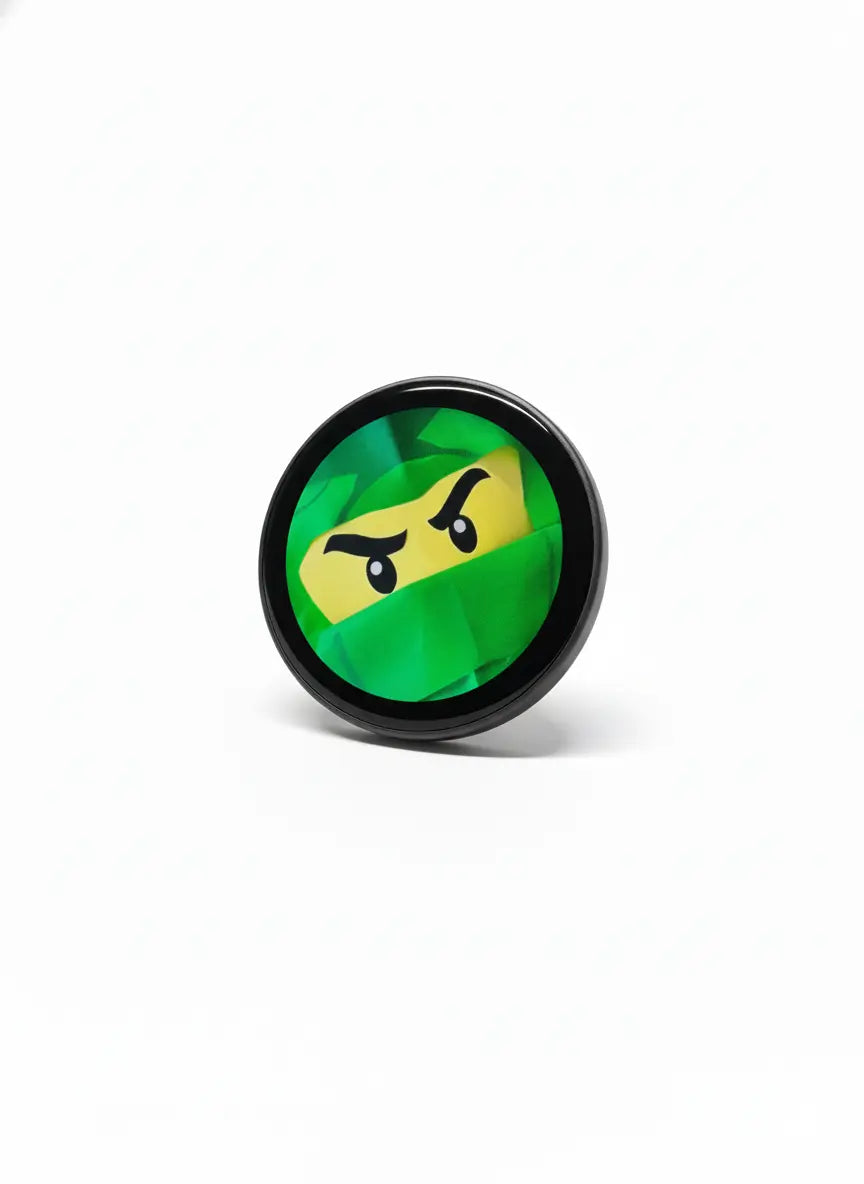 Smart LED badge showing green ninja pixel art on a round digital display
