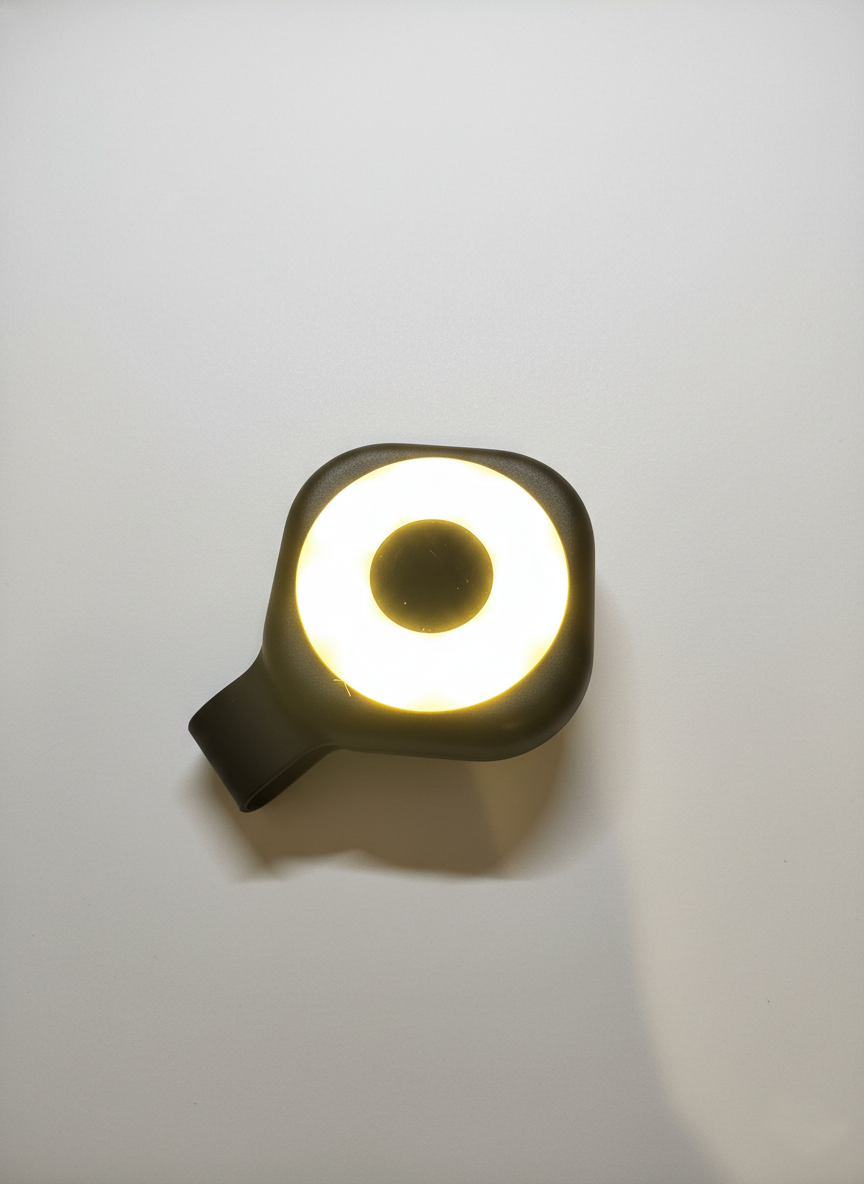 Wearable magnetic clip flashlight turned on with bright circular LED light